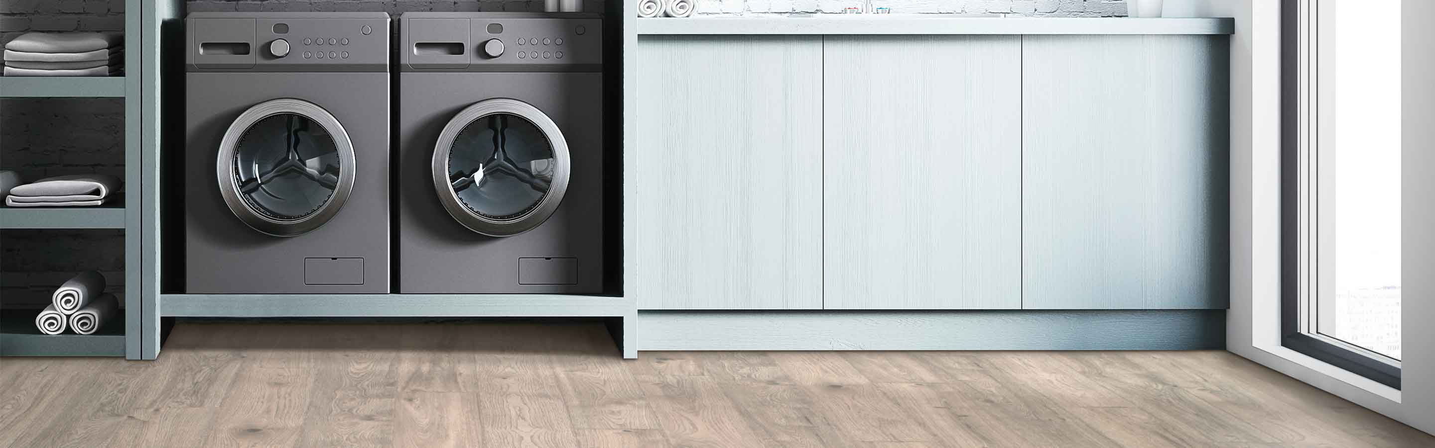 Laminate flooring in a laundry room with built-in shelving