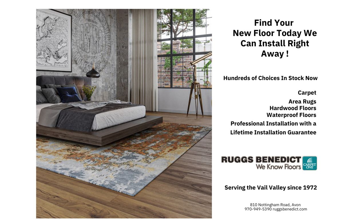 Area rug laying on a hardwood floor in a bedroom.