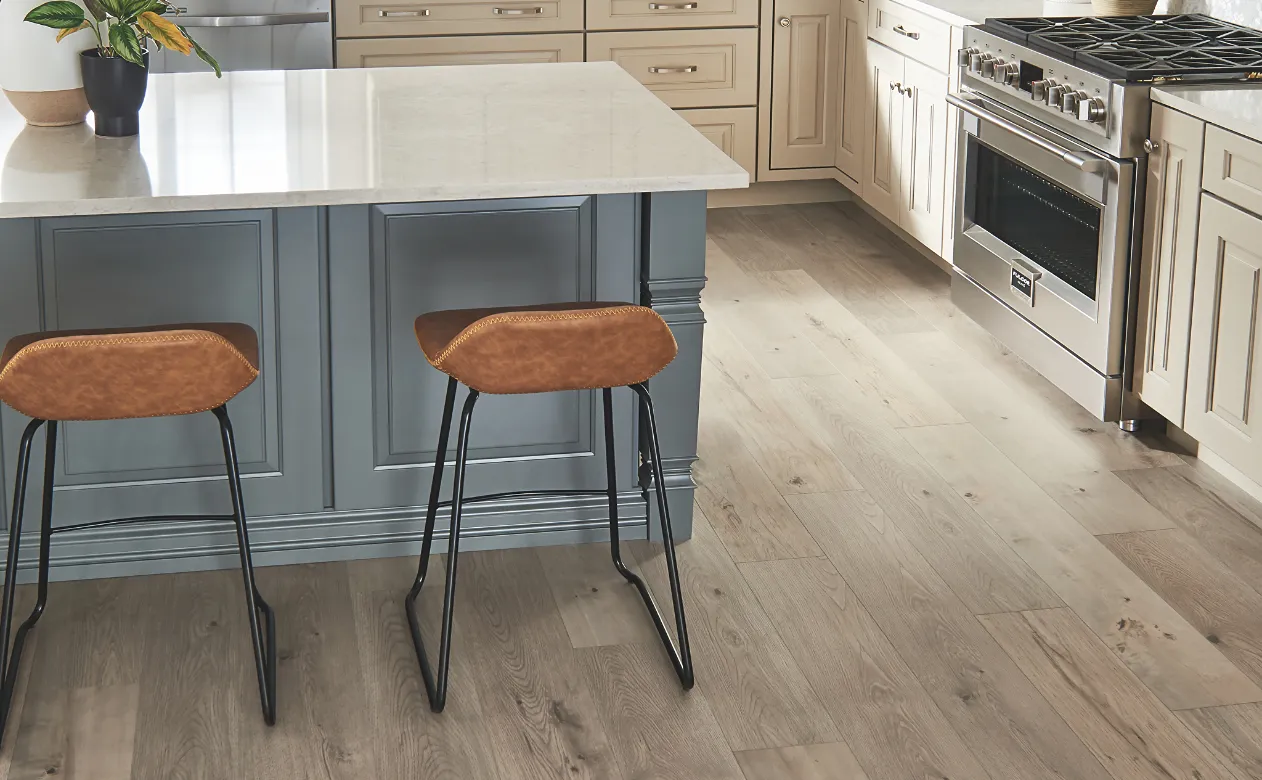 Kitchen with wood-look laminate flooring and a kitchen island