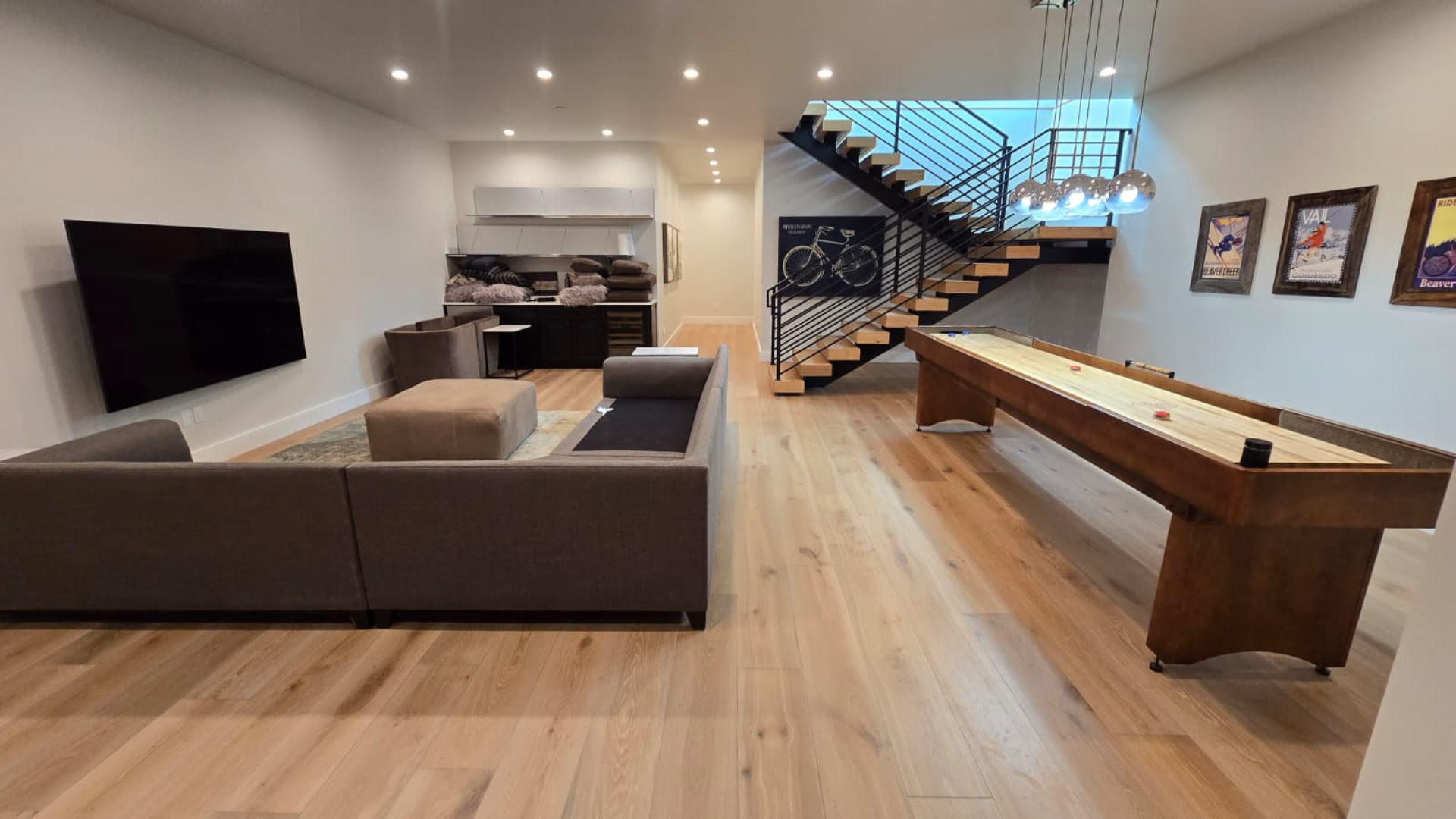 luxury flooring installation in game room with stairs in CO