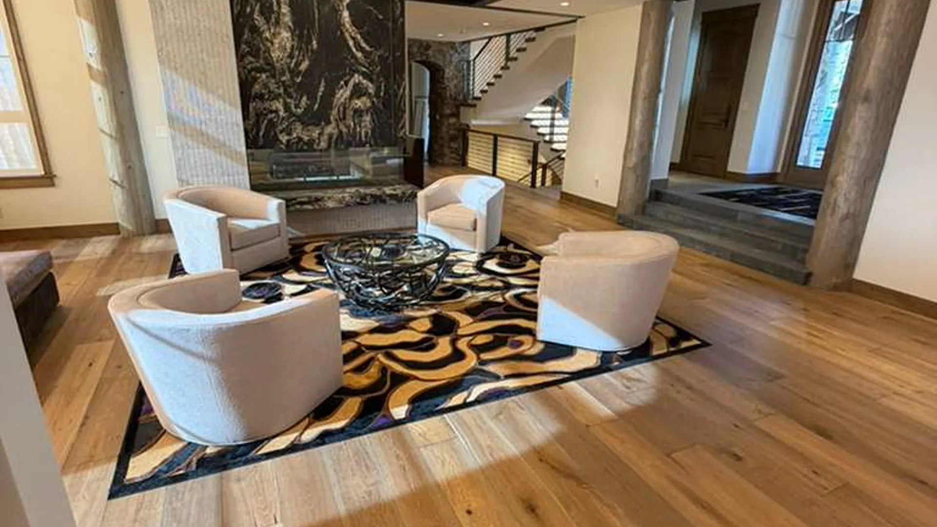 Hardwood floors with four chairs & rug, hardwood installation Vail Valley 
