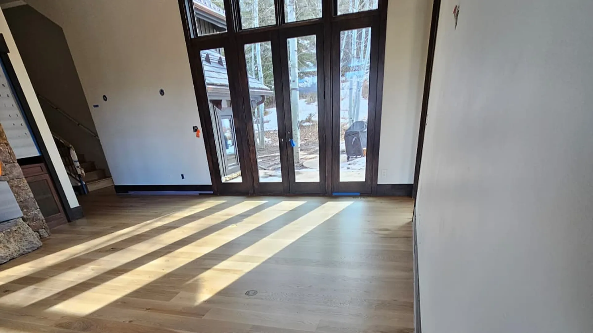 Windows, light streaming on hardwood flooring in Eagles Nest, CO 