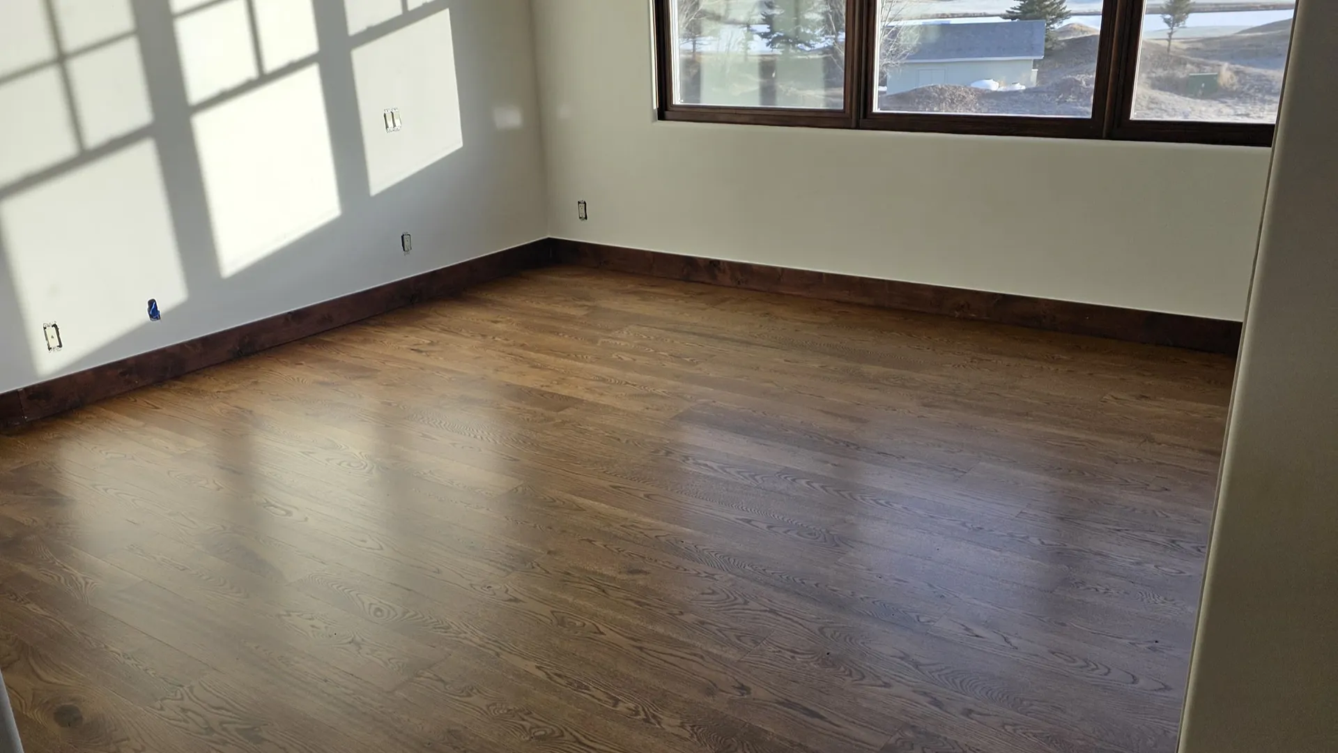 dark hardwood floors installed in Colorado mountains 