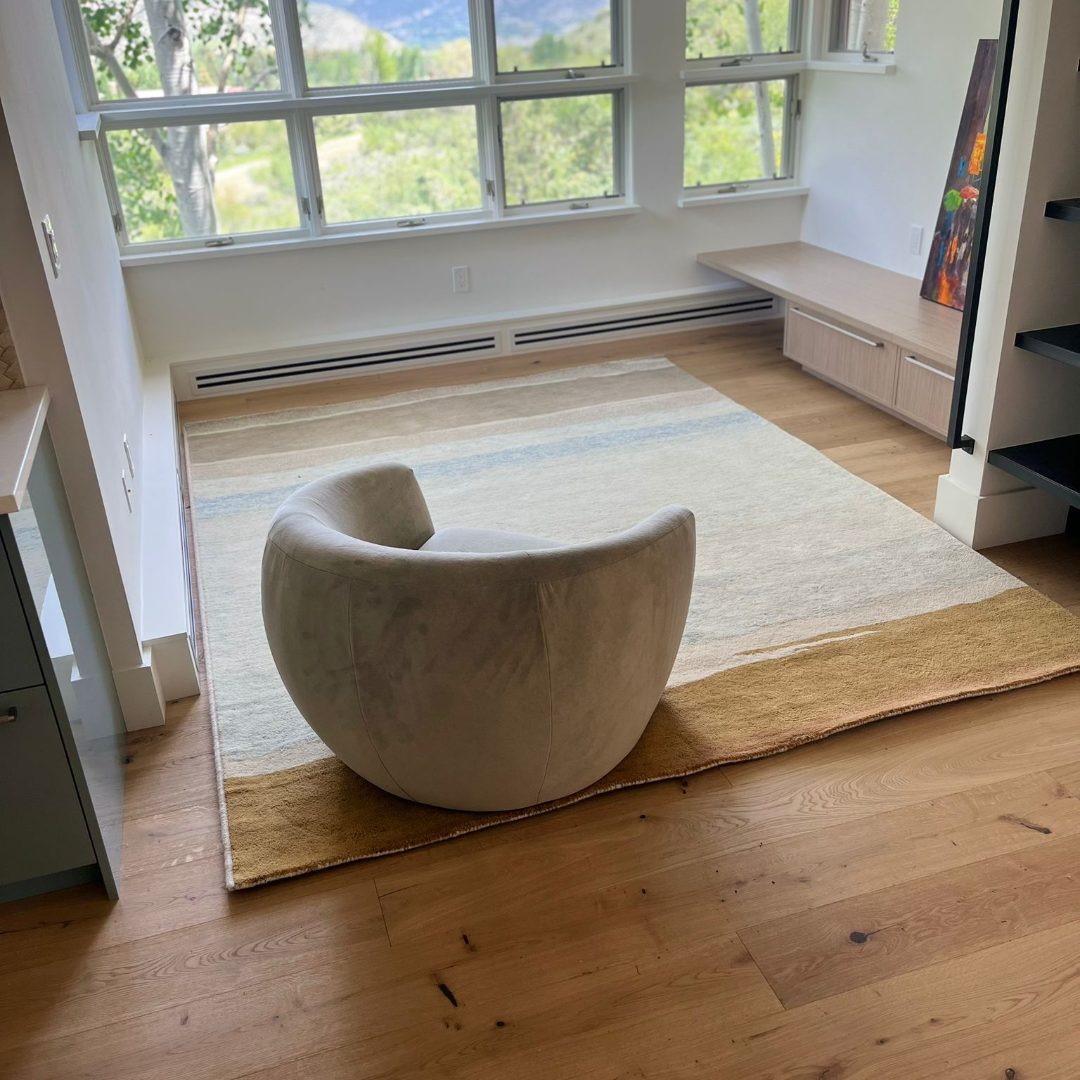 Den with full hardwood floors.