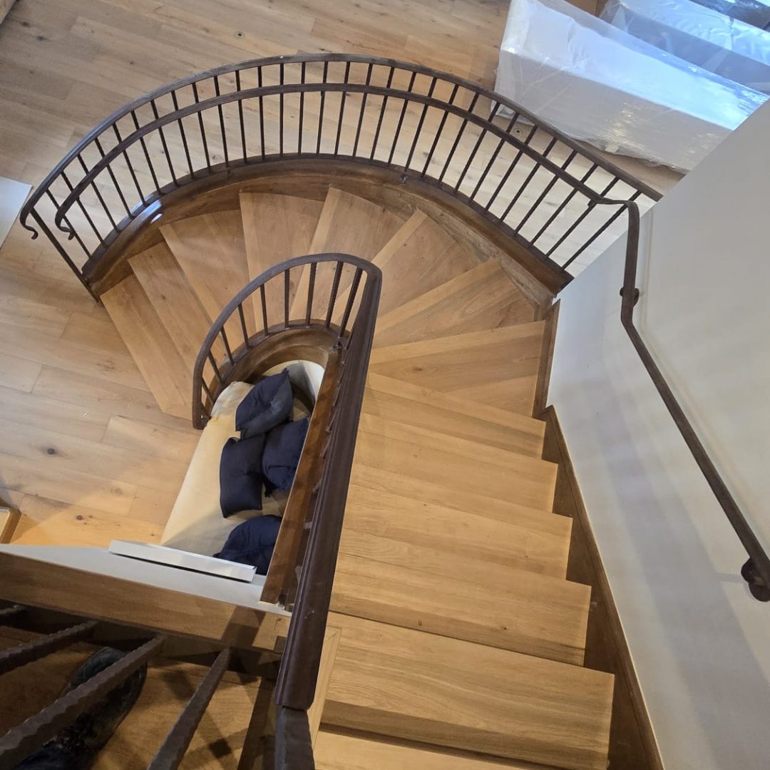 Spiral stairs with complete hardwood flooring in Colorado.