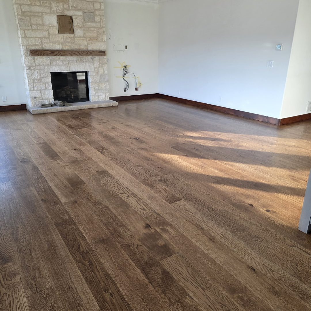 Premium hardwood floors from Ruggs Benedict and a fireplace.