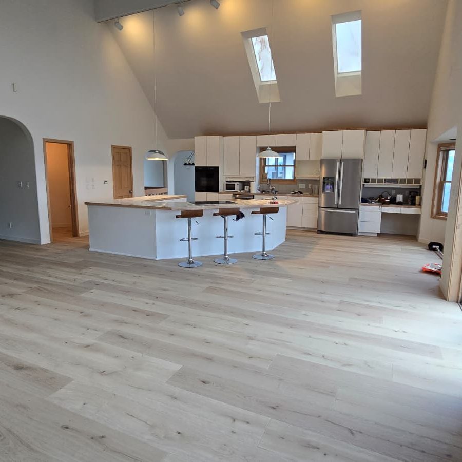 Kitchen area with premium hardwood floors from Ruggs Benedict Carpet One