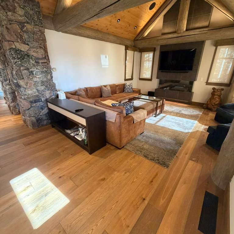 Living room area with premium hardwood floors from Ruggs Benedict Carpet One.